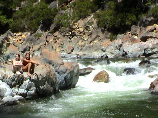 girls on rocks at creek